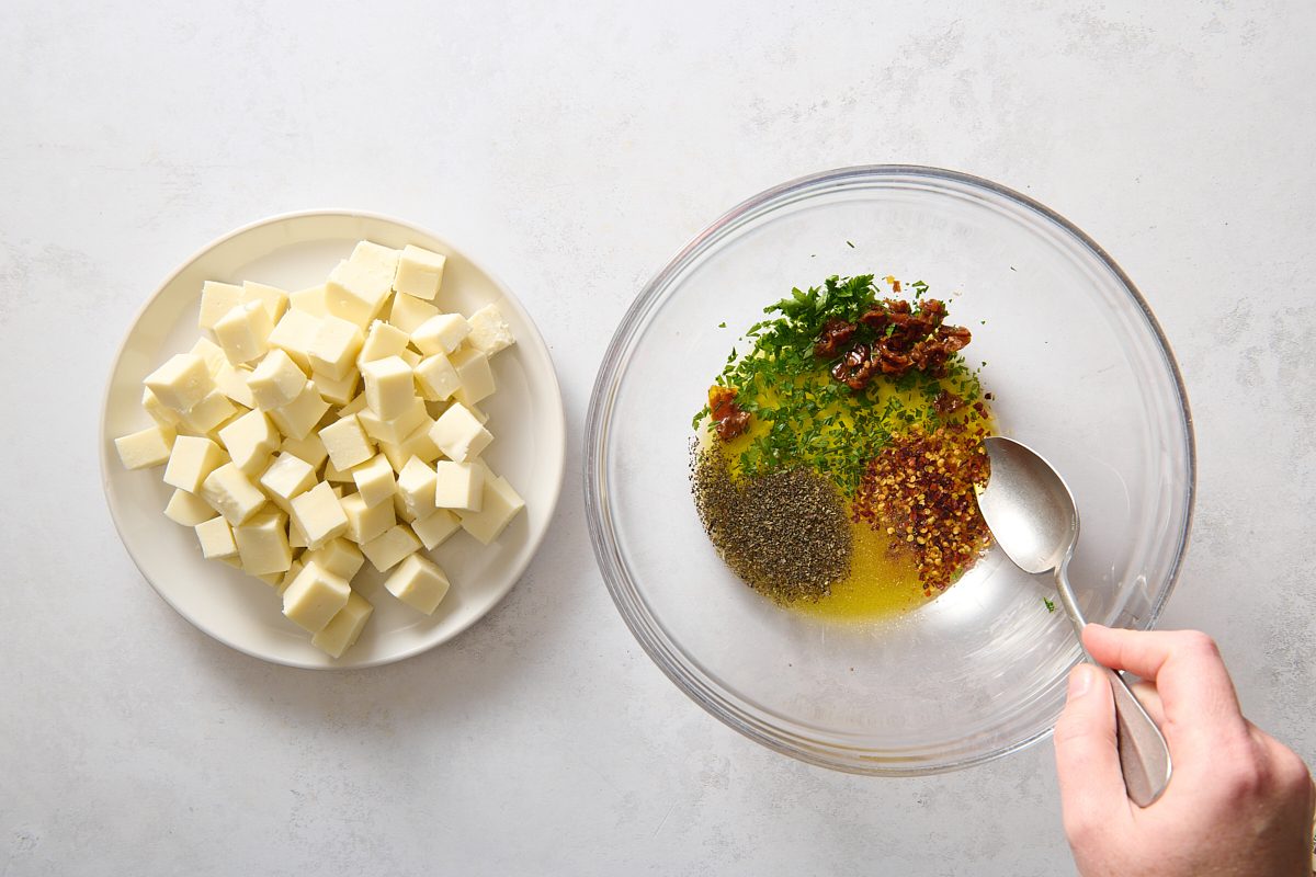 Combining marinade in a large bowl before adding the mozzarella