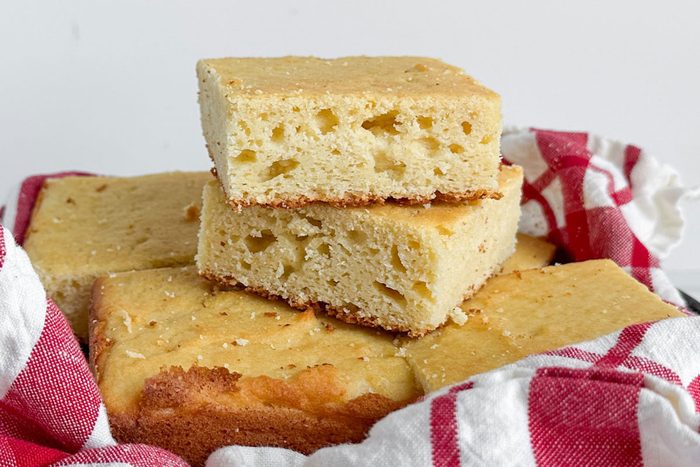 Taste of Home Masa Cornbread in a napkin lined metal pan
