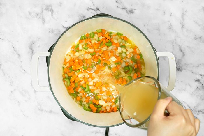 Adding broth in saute onion, carrot and celery