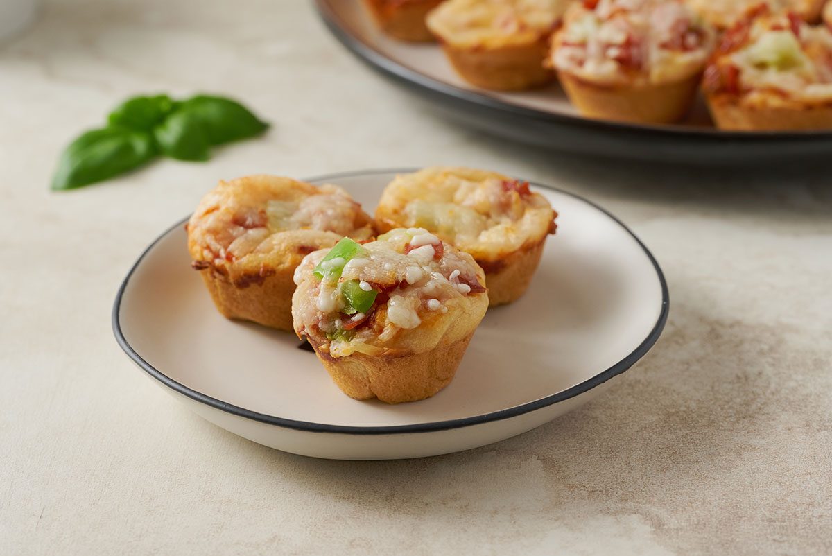 Close-up horizontal shot of the Taste of Home Pizza Bites, highlighting the crispy crust and gooey melted mozzarella cheese.