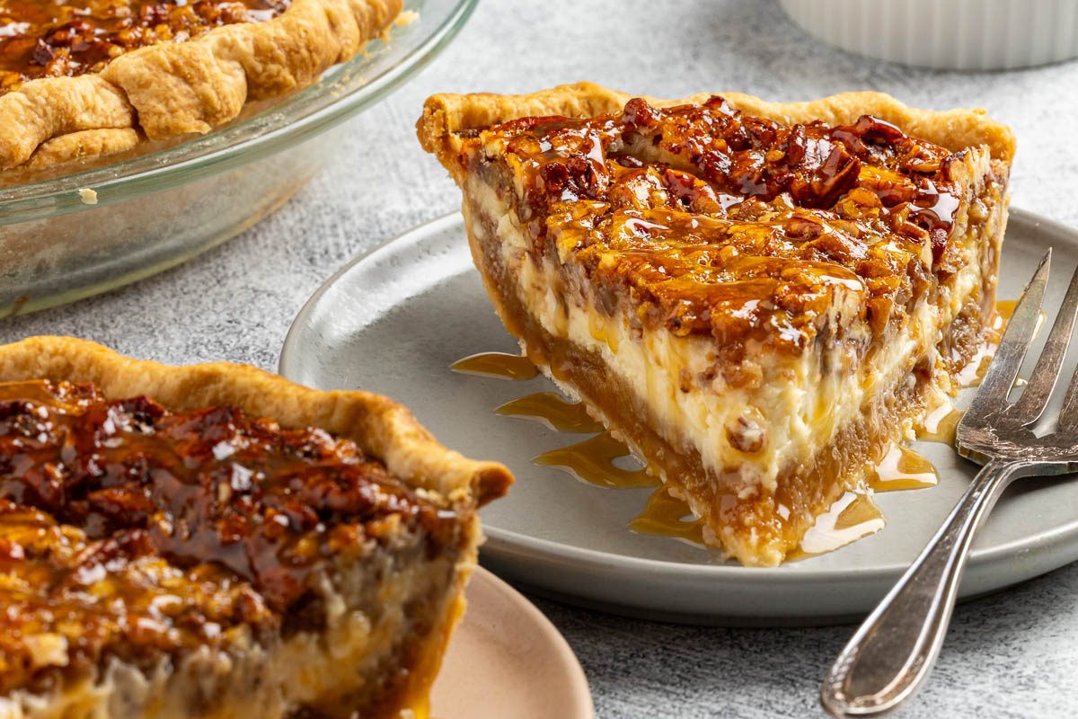 Pecan Cheesecake Pie with a slice served on a plate