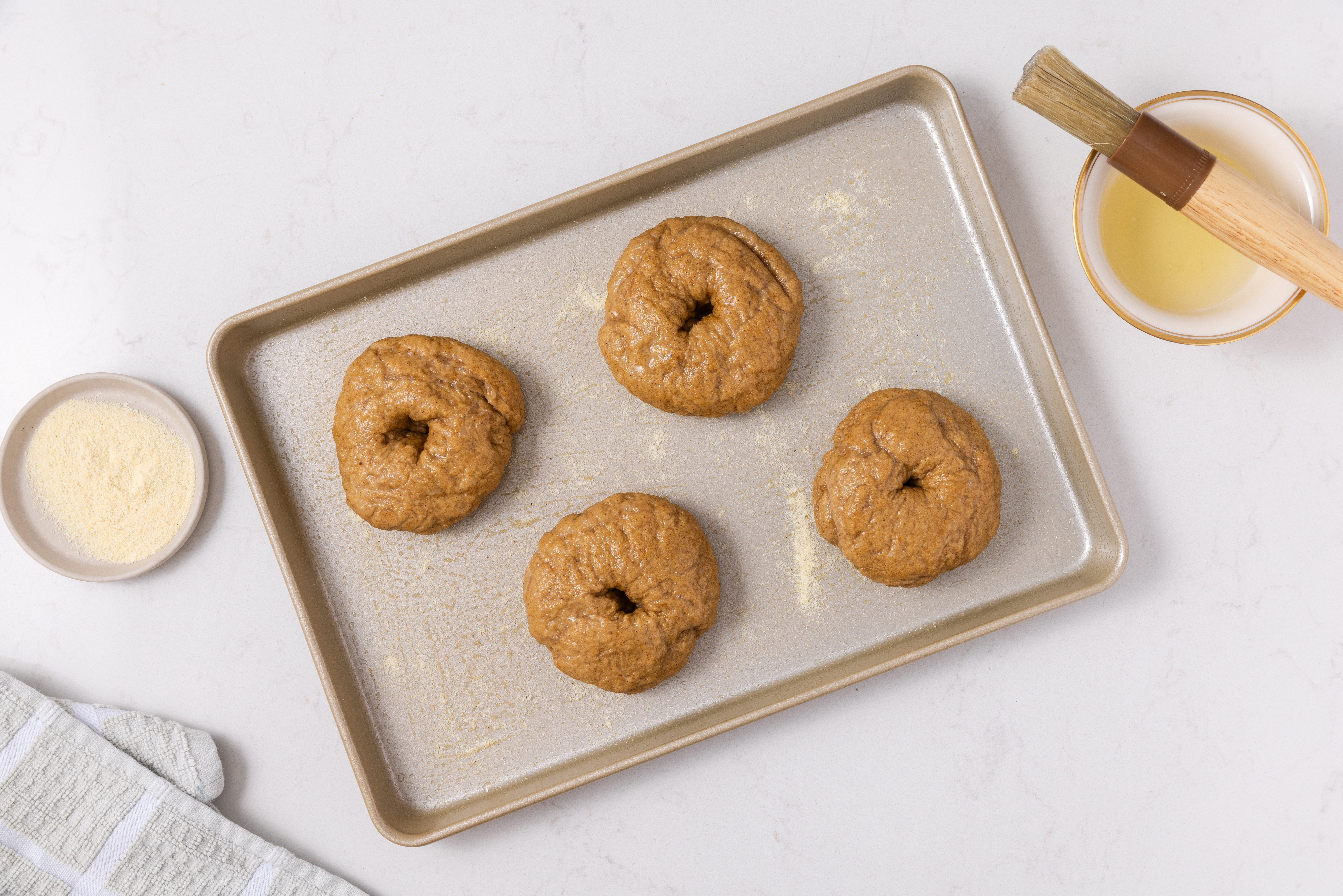 Bagels in baking sheet ready to bake.