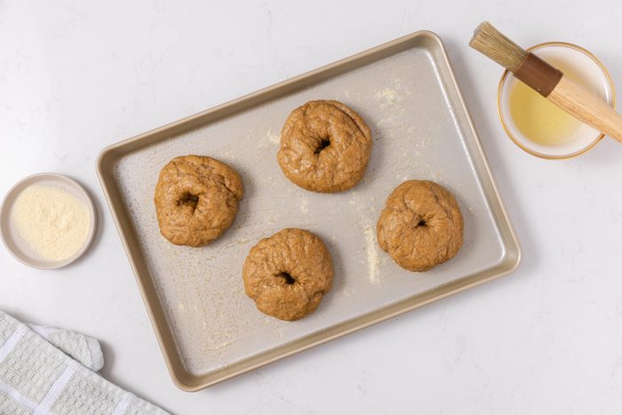 Bagels in baking sheet ready to bake.