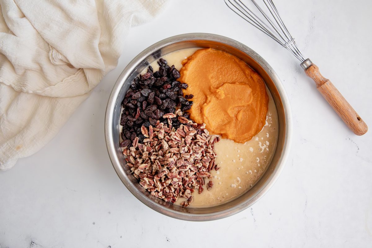 Overhead shot for Taste of Home Pumpkin Raisin Bread, ingredients before mixing in a large bowl.