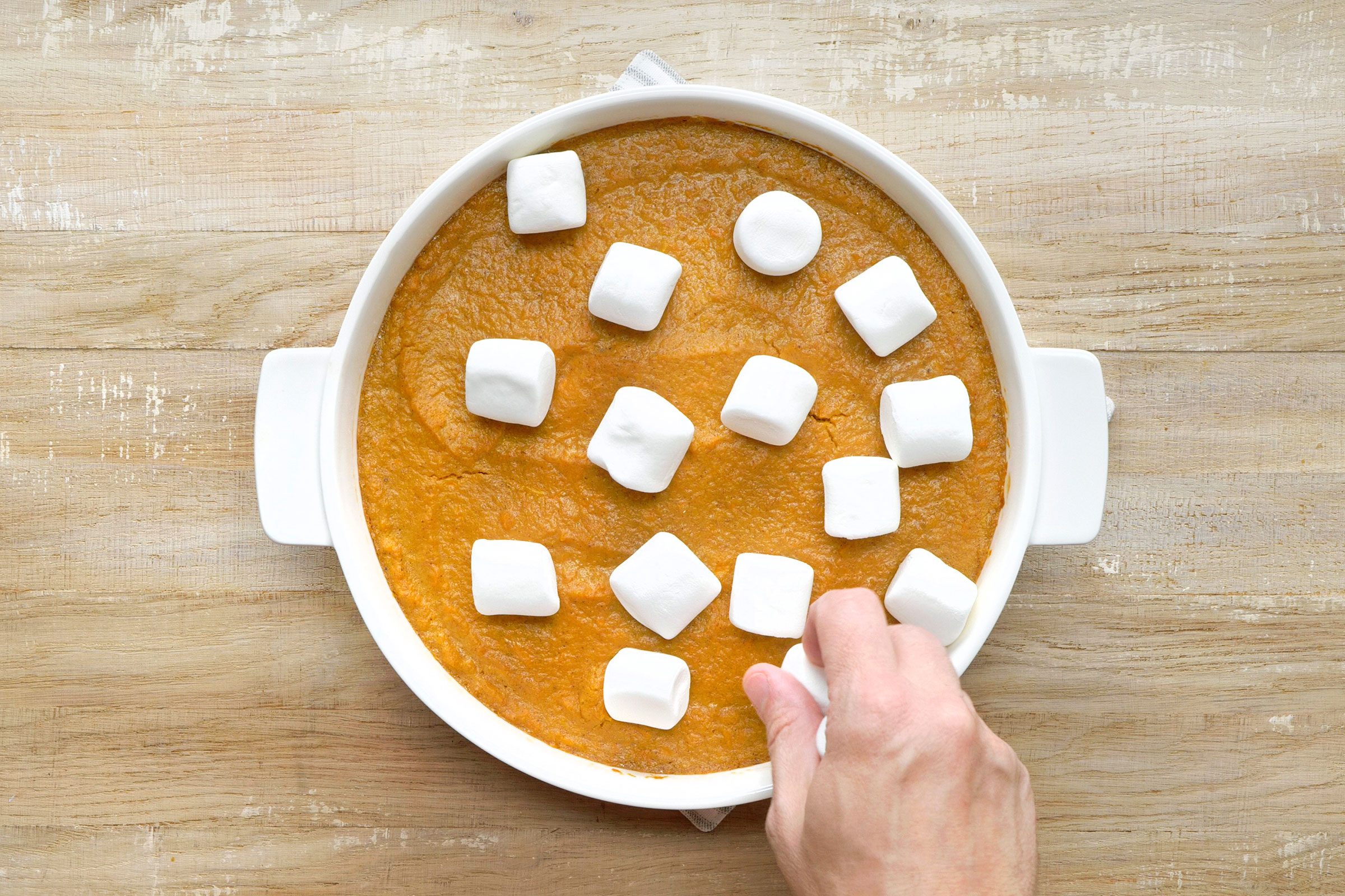 Add marshmallows and bake the sweet potato casserole
