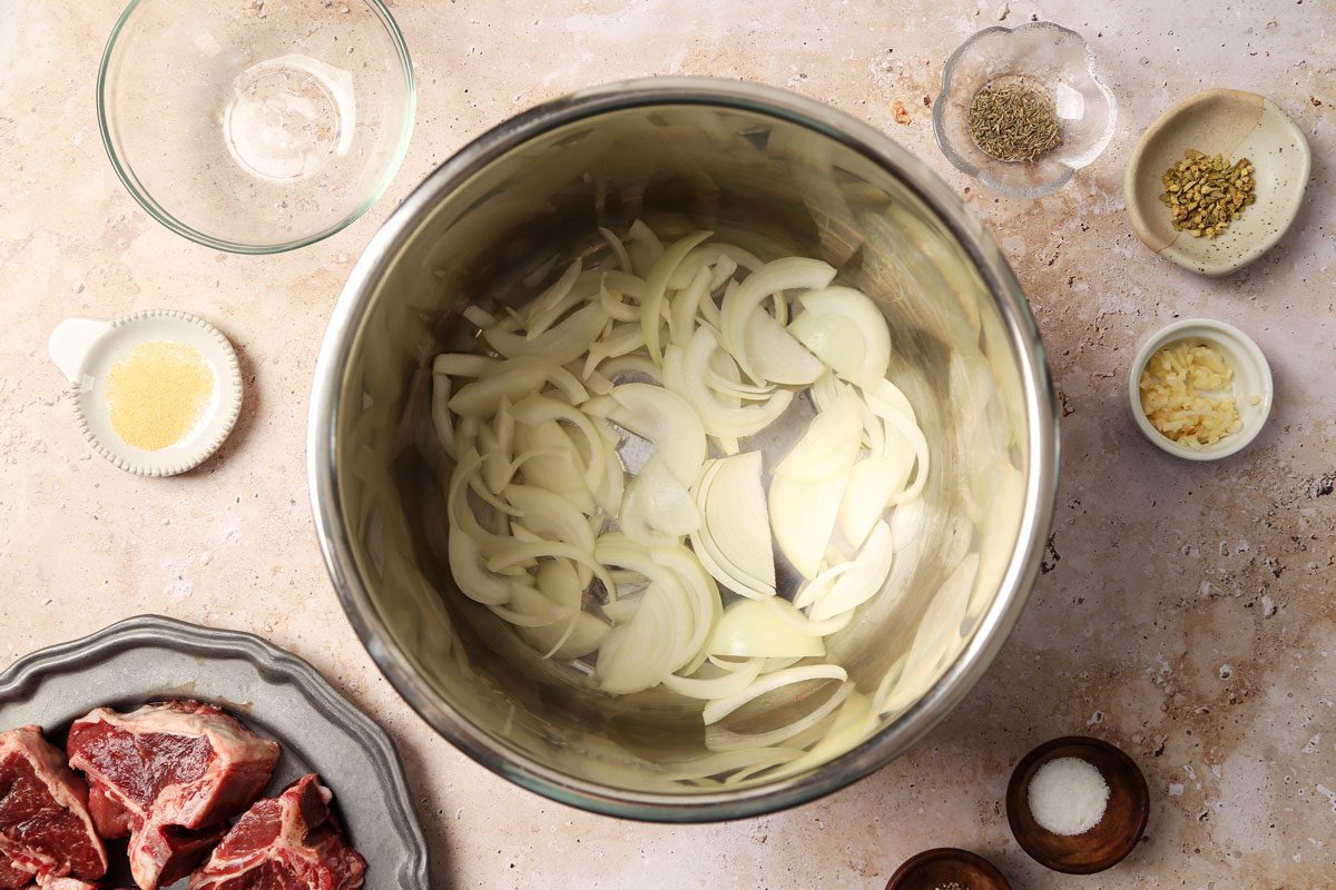 Process of making Taste of Home's Slow Cooker Lamb Chops in a slow cooker on a beige marble surface.