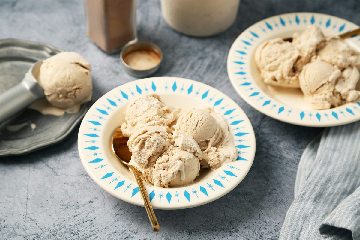 Close Up of Taste of Home's Cinnamon Ice Cream served in bowls on a blue surface.