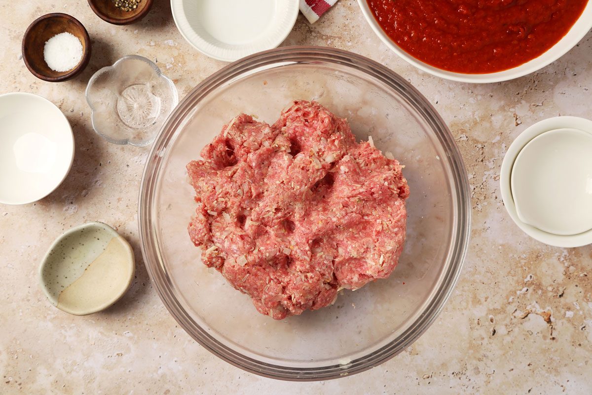 Process of making Taste of Home's Instant Pot Meatballs in an instant pot on a brown marble surface.