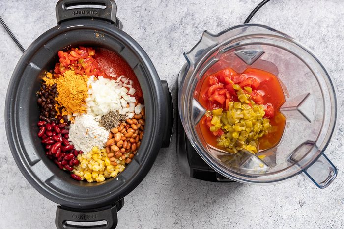 all the ingredients added to the slow cooker.