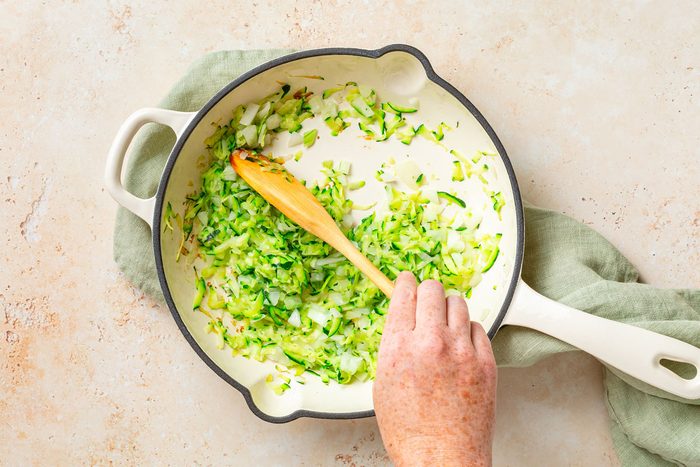 Frying Zucchini And Onion In A Skillet