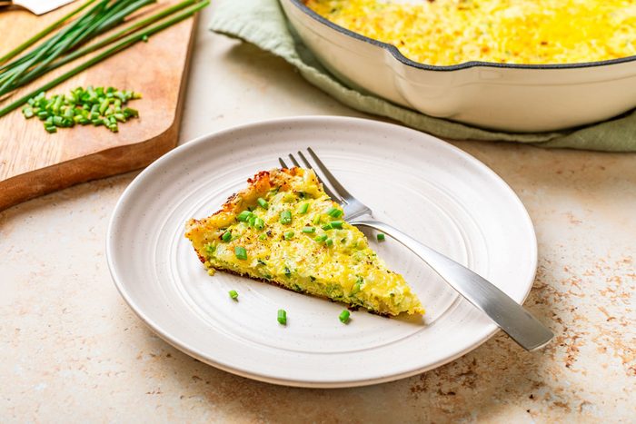 Slice Of Frittata On A Plate With A Fork