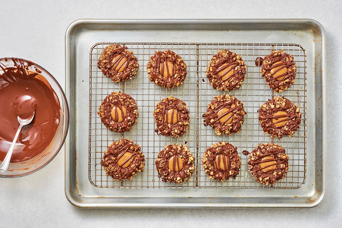 Melted chocolate drizzled over the cookies