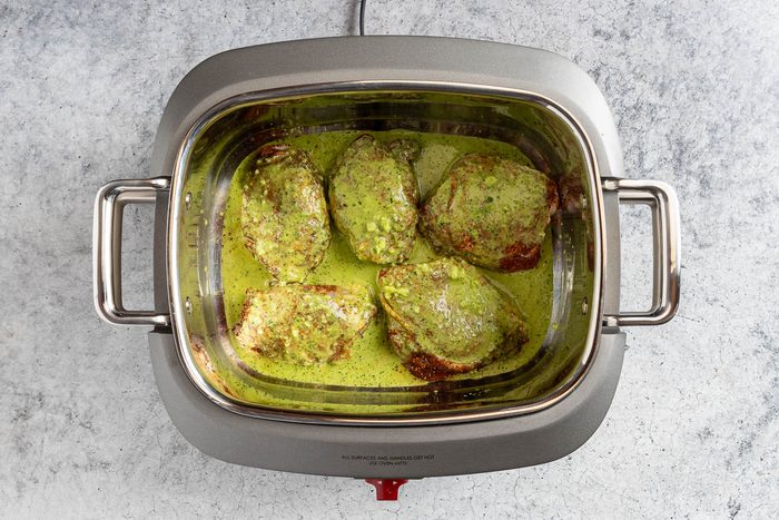 Taste of Home Cilantro Lime Chicken photo of the marinade poured over the chicken.