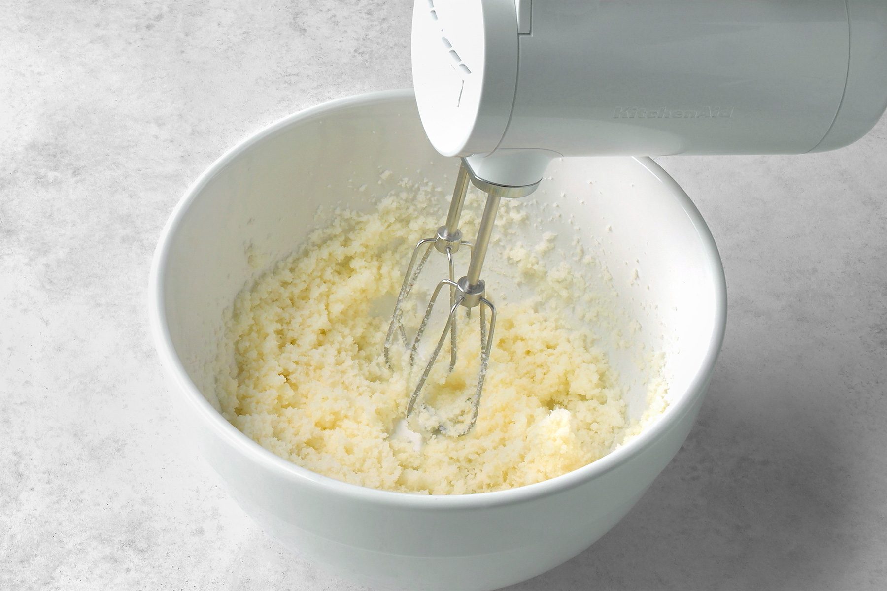 In a large bowl, beat butter and sugar at medium speed until light and fluffy,