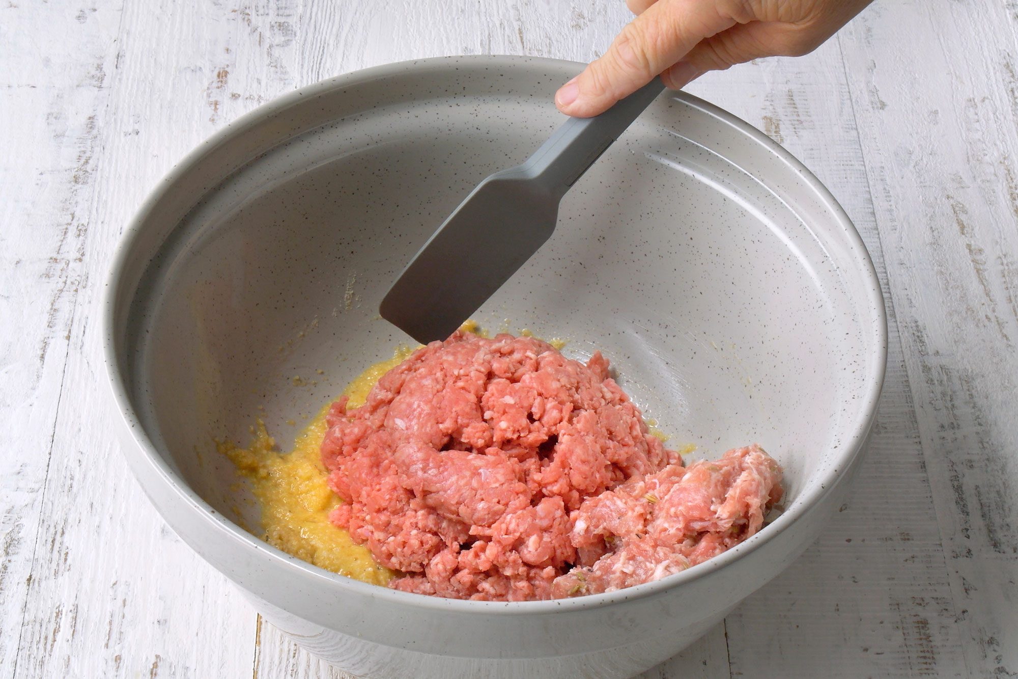 Add beef and sausage mix well