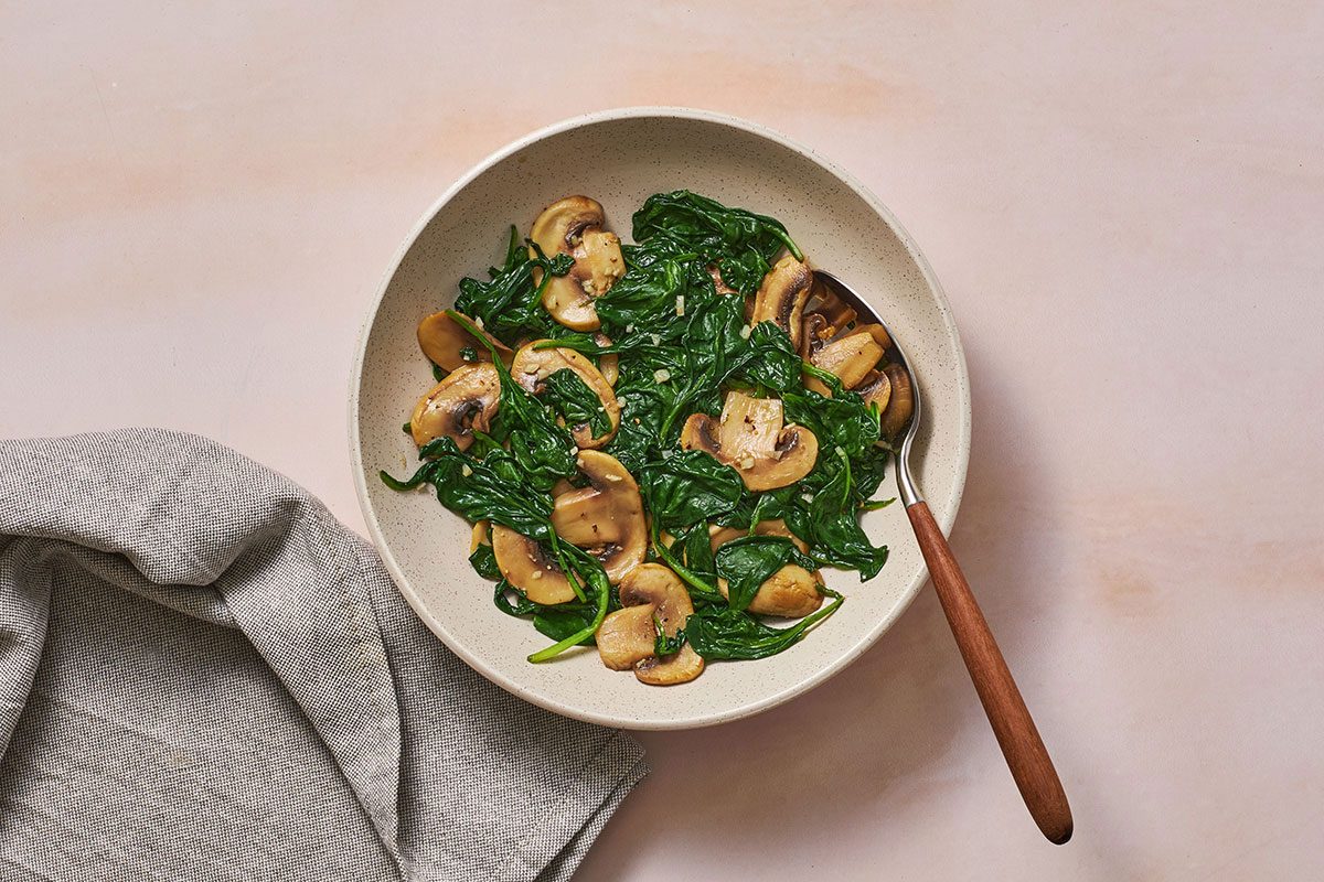Sautéed mushrooms and spinach in a bowl