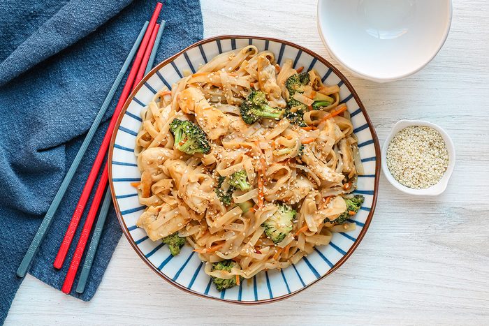 Taste of Home's peanut chicken stir-fry with broccoli, shredded carrots, sesame seeds and homemade Asian peanut sauce.