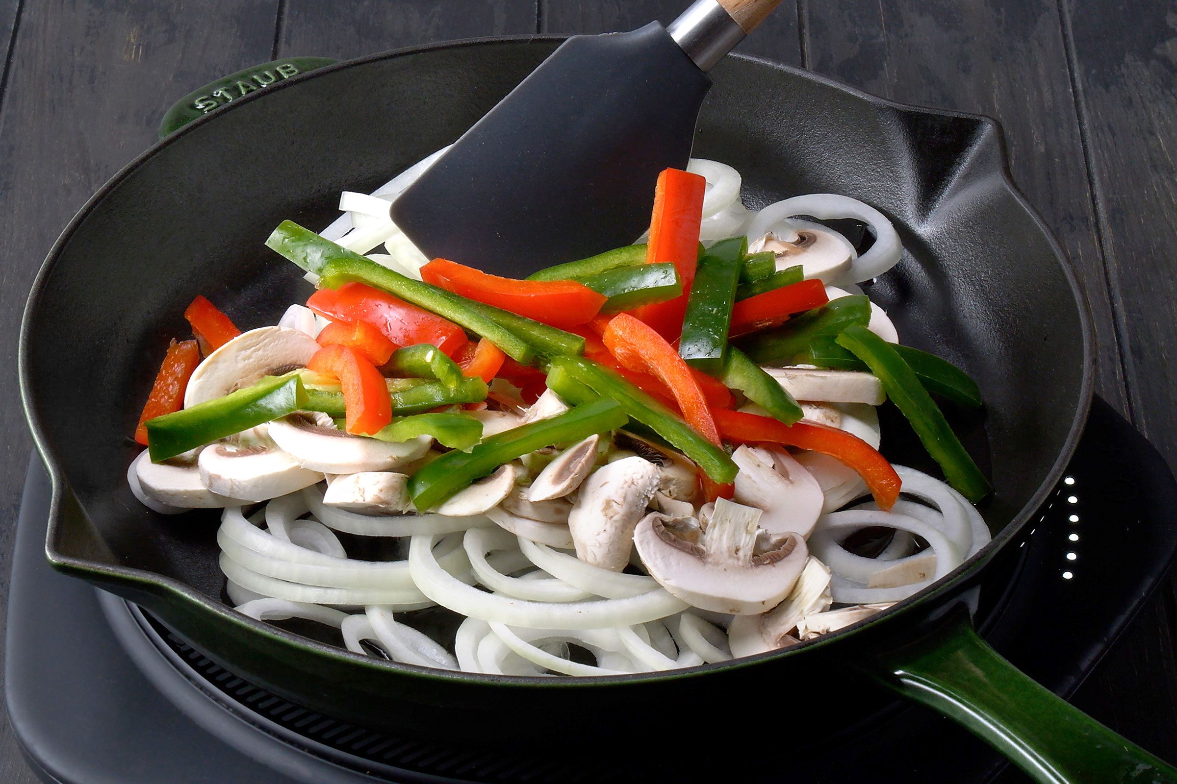 Sautéing vegetables in a large skillet