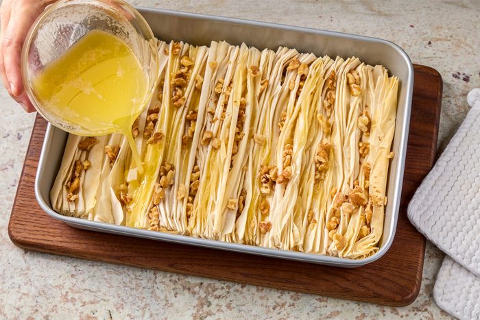 Drizzle melted butter evenly on top.