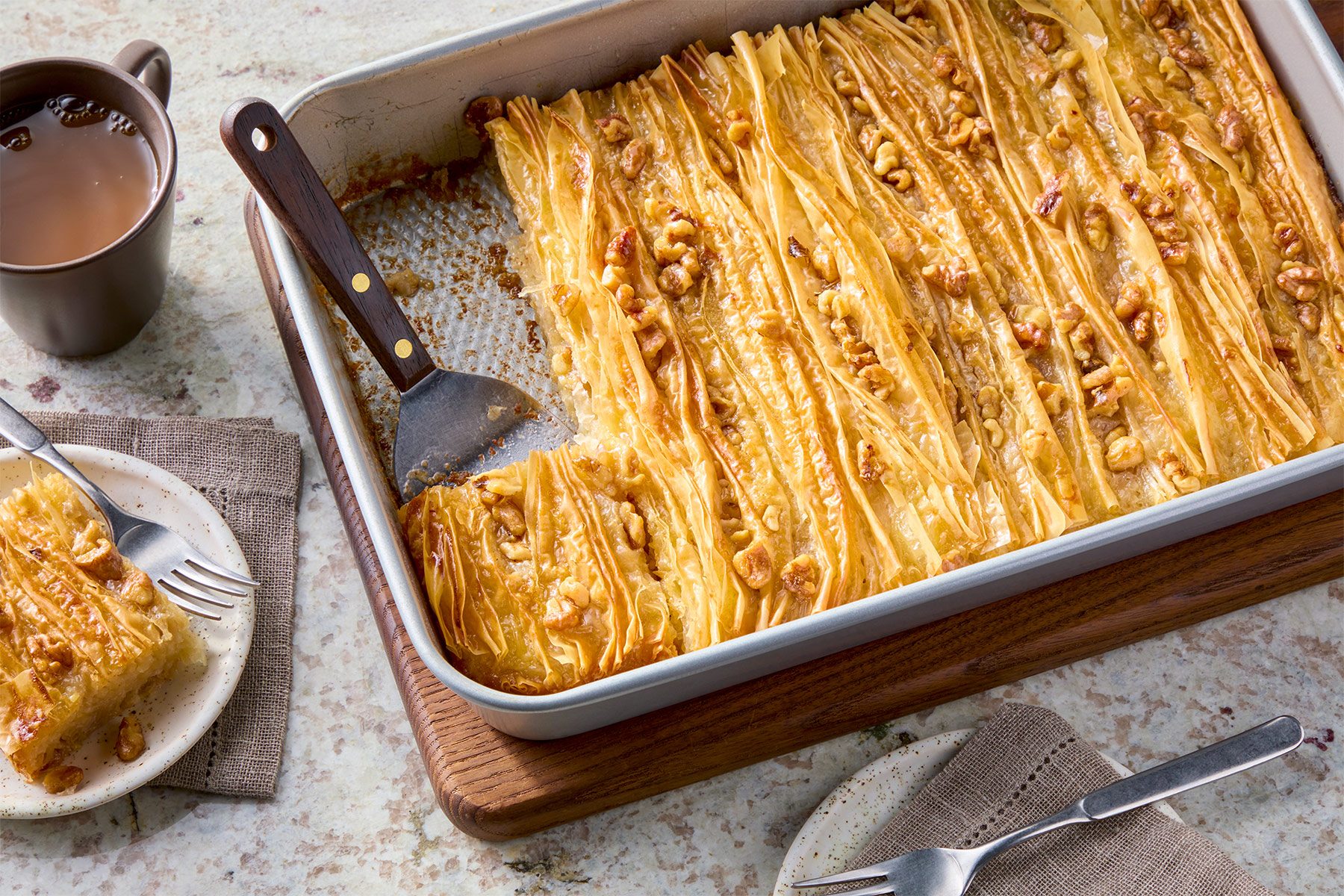 3/4th shot of phyllo crinkle cake in a baking dish