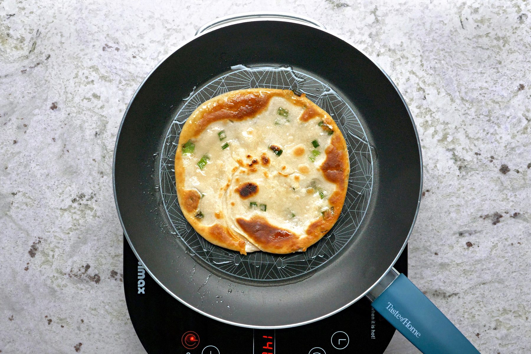 Cooking the pancake in a skillet.