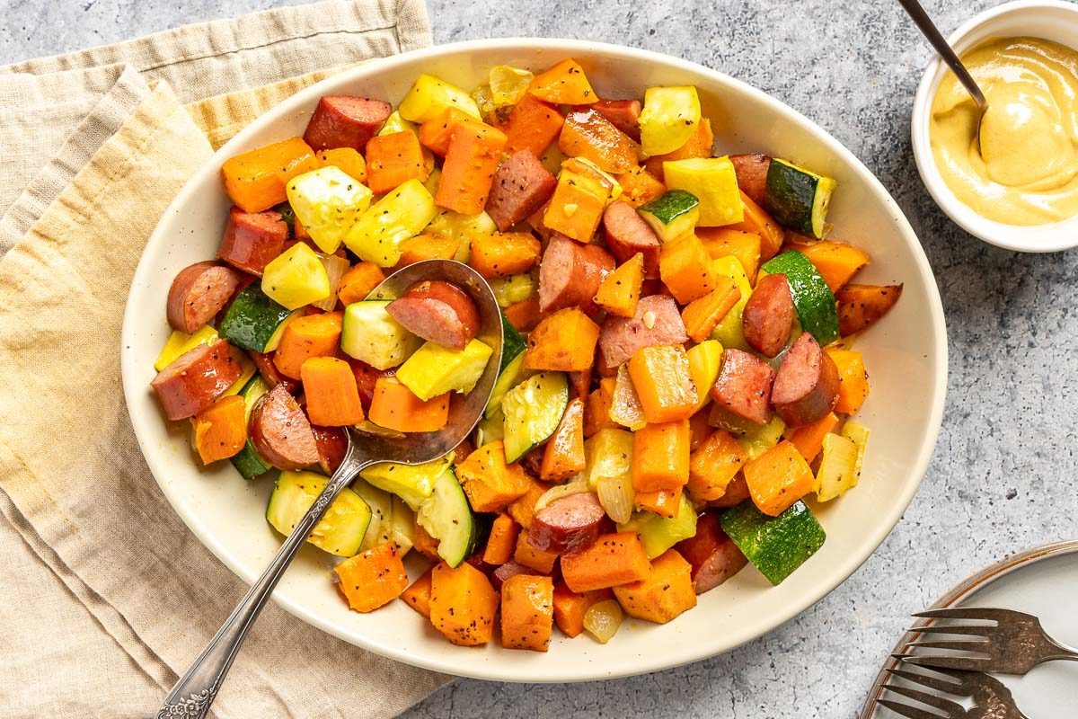 Taste of Home Sheet Pan Kielbasa and Veggies photo of the finished recipe in a serving dish.