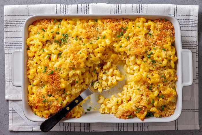 Truffle Mac And Cheese topped with chives in a dish