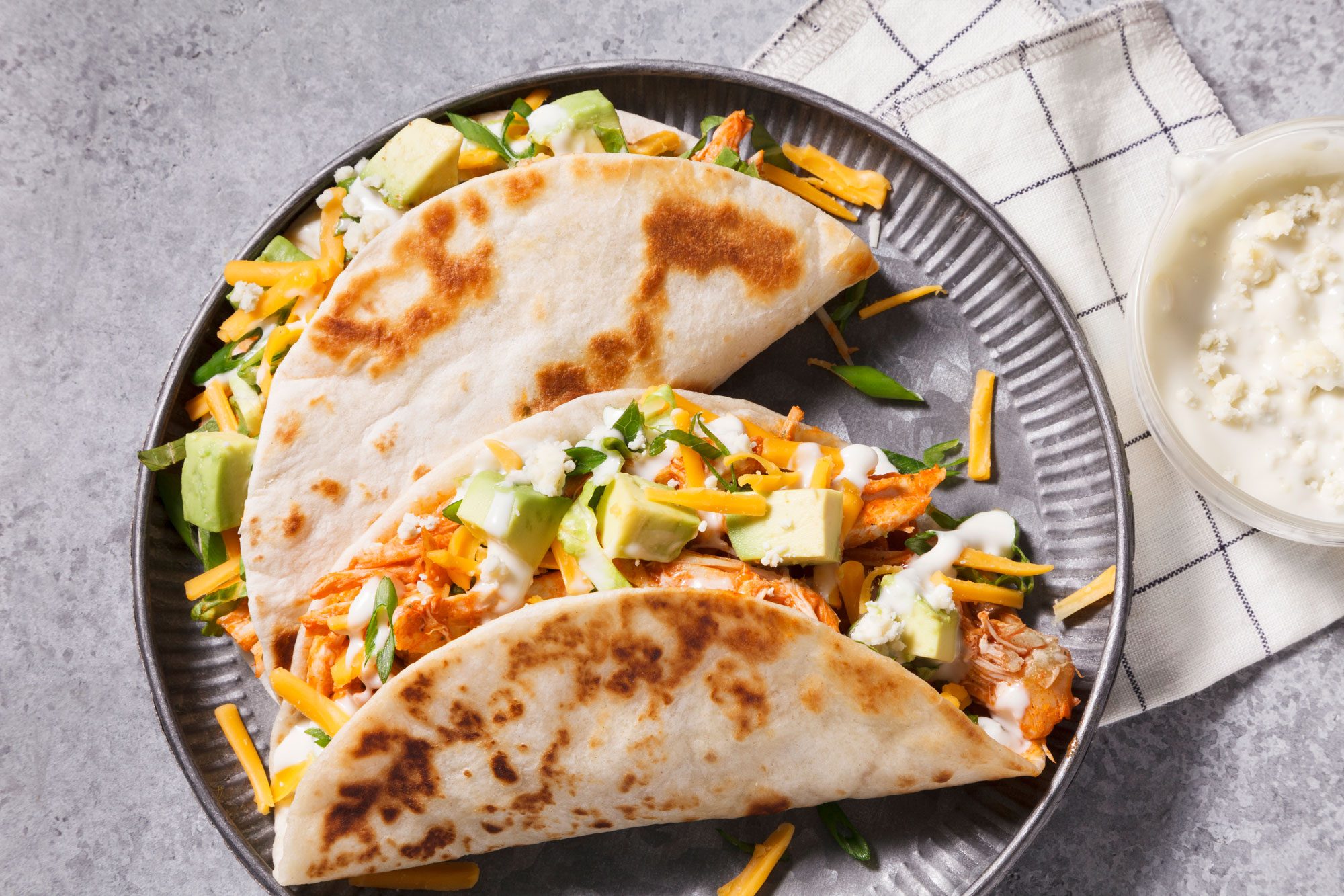 Two Buffalo Chicken Tacos served in a plate