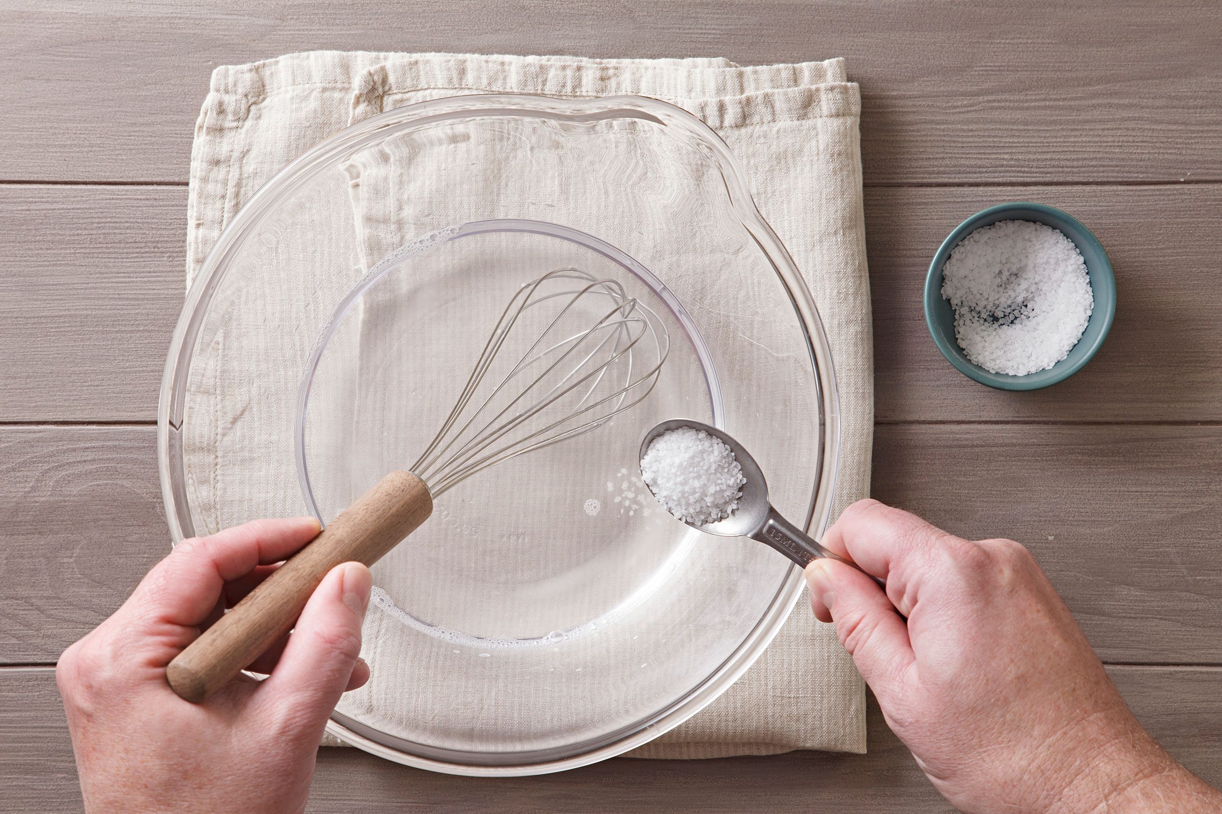 Whisking salt and water together in a large bowl