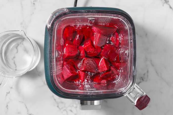 Beet pieces and water in a blender