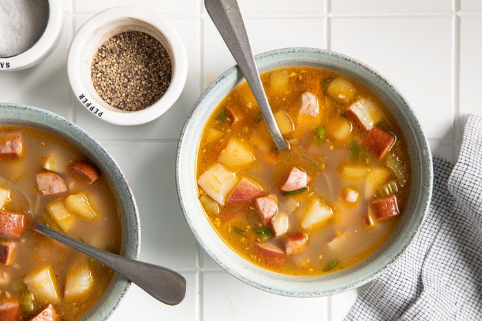Pork Chop Soup served in bowls with spoon and black pepper on the side