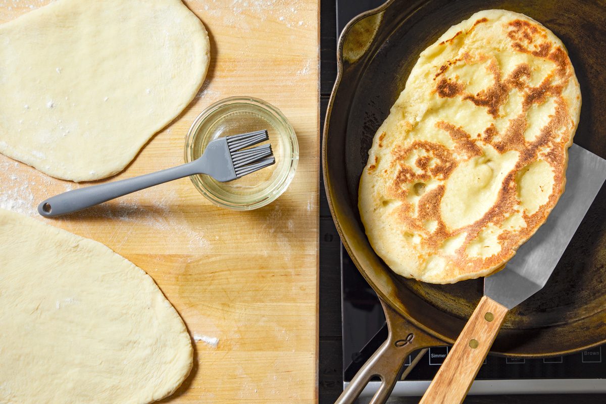 dough being fried in skillet