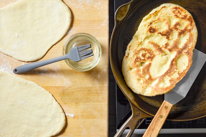 dough being fried in skillet