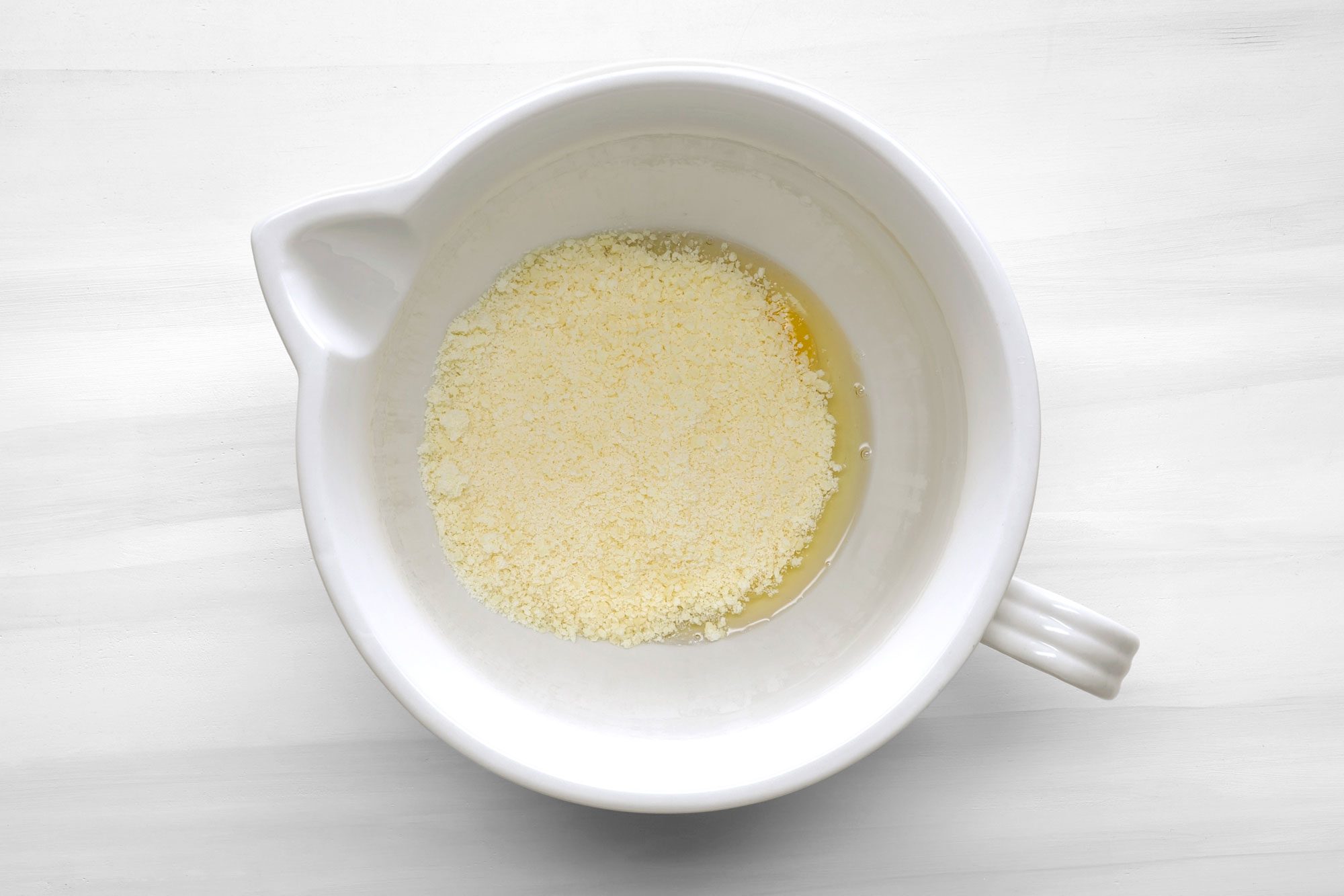 In a large bowl, whisk eggs and Parmesan