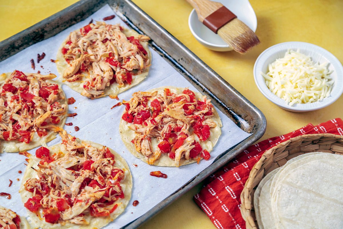 chicken mixture spooned over tortillas