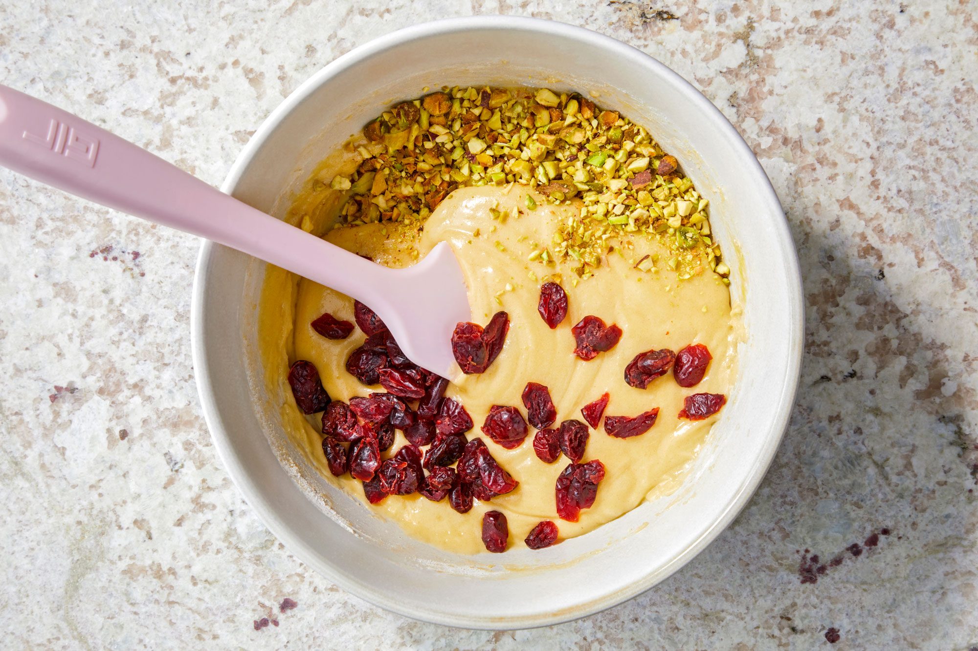 stir in pistachios and cranberries with spatula