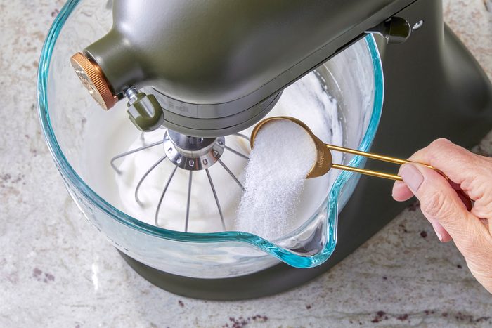 Gradually add sugar, 1 tablespoon at a time