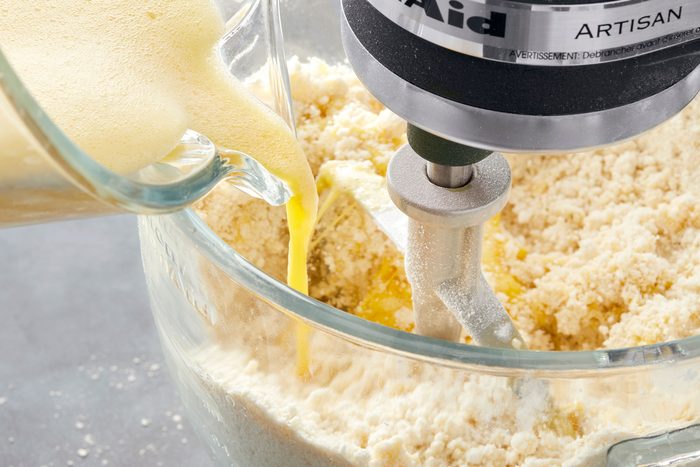 Gradually add beaten eggs; dough will be stiff