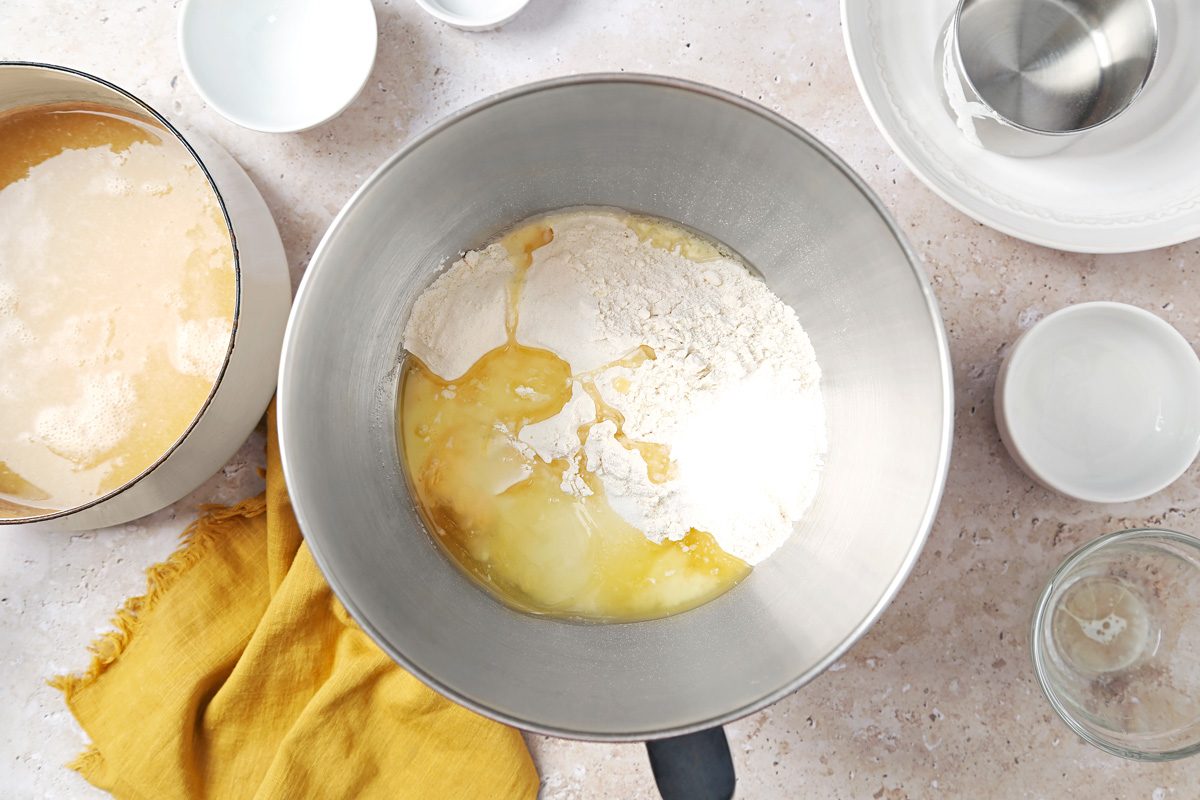 butter, sugar, 1-1/2 teaspoons salt, yeast mixture and 3 cups flour in a large bowl