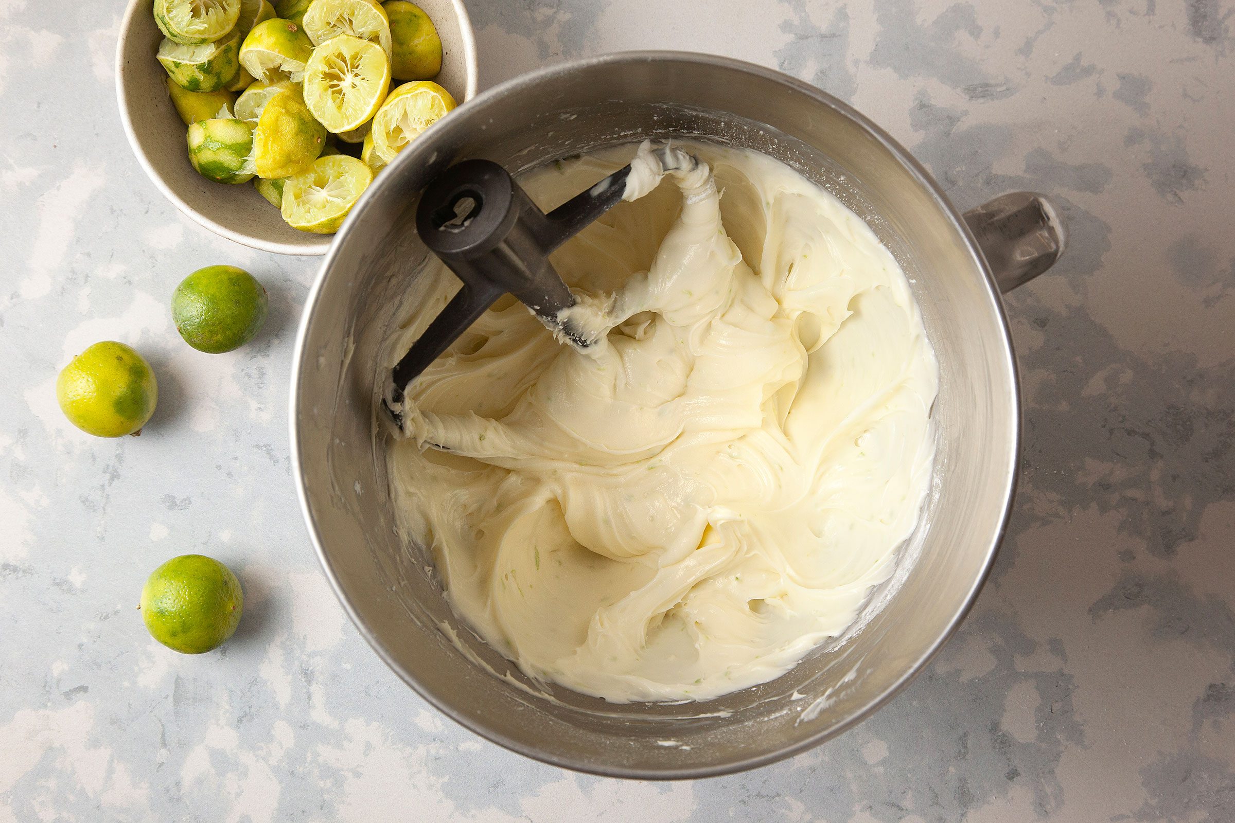 Beaten eggs, lime juice and vanilla in flour mixture in a large bowl