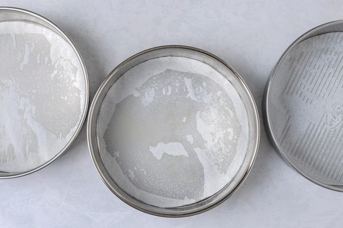 Line three 9-in. round baking pans with parchment paper.