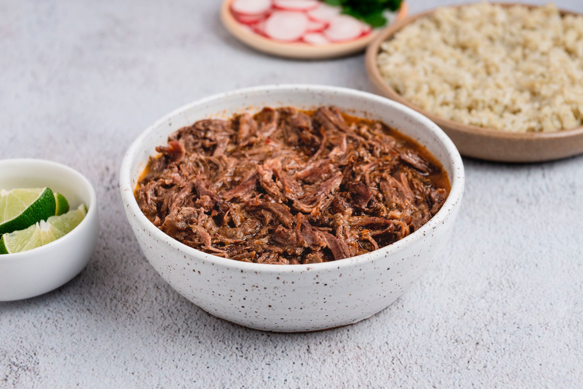 Slow Cooker Barbacoa is ready and served in plate