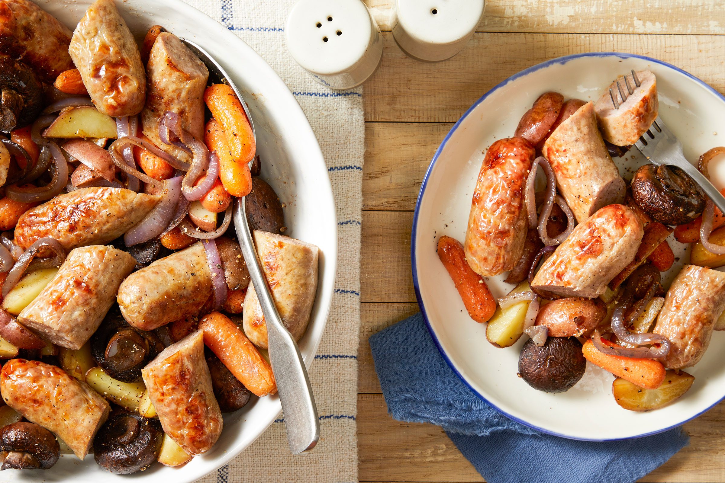 Bratwurst Supper in a large bowl and served on a small plate with salt and pepper shaker kept on the side