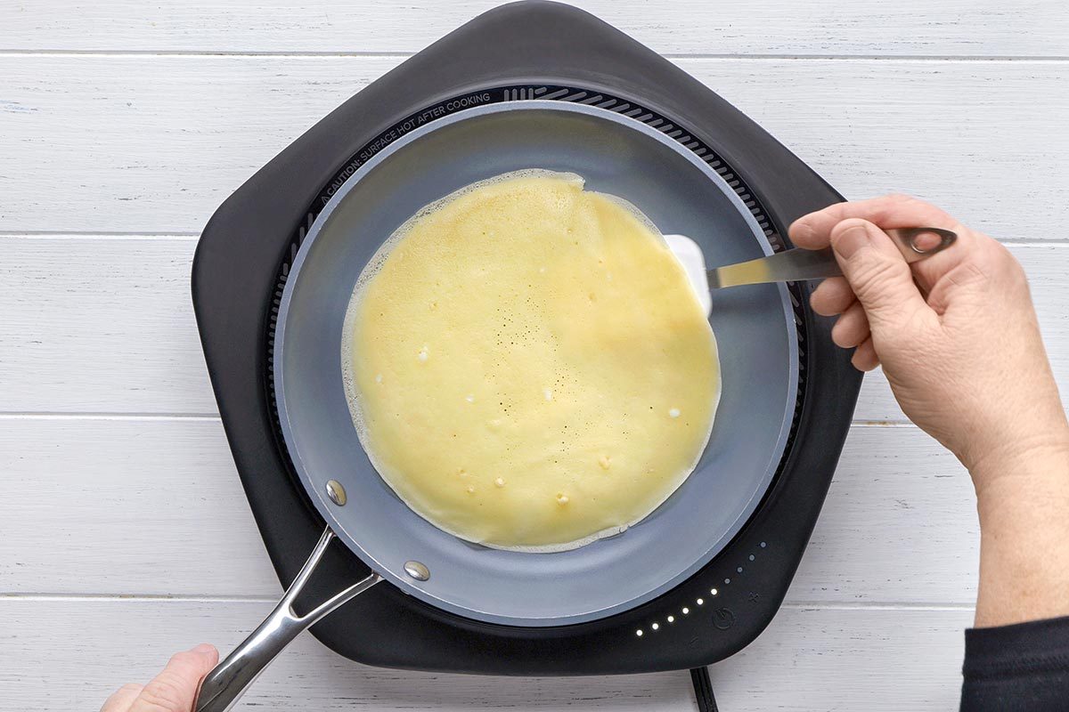 Crepe Cake being cooked on a pan.