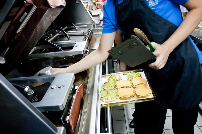 Making burgers from cutlets and shelves at McDonald
