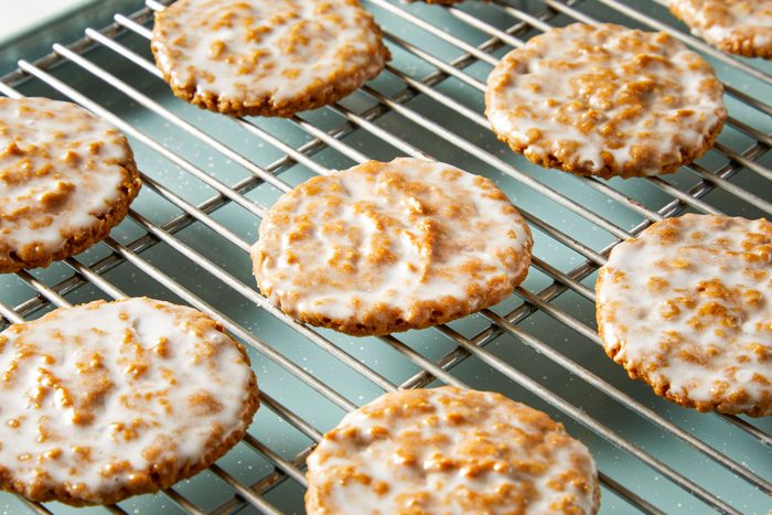 Iced Oatmeal Cookies on a wired rack