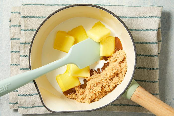 Overhead shot of a small saucepan combine glaze ingredients; bring just to a boil stirring constantly