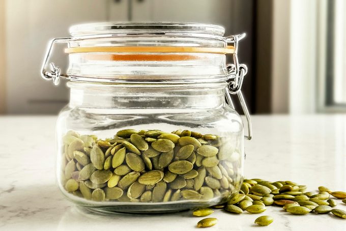 Jar of pumpkin seeds on the kitchen table