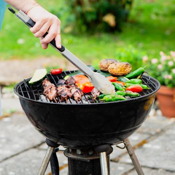 cook barbecue with vegetables in the grill
