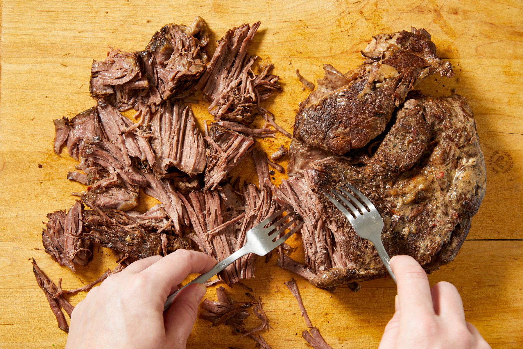 Boneless roast thinly shredded using forks.